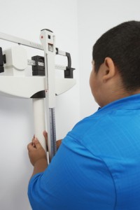 Obese Boy Measuring Weight